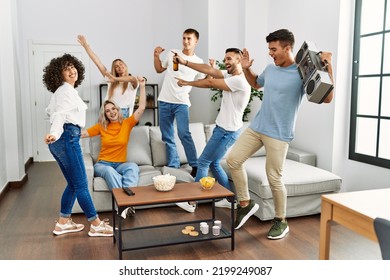 Group Of Young Friends Smiling Happy And Dancing At Home.