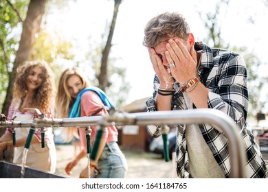 Group of young friends at summer festival, washing in the morning. - Powered by Shutterstock