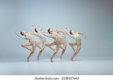 Group of young girls, ballet dancers performing, posing isolated over grey background. Flexibility, attraction, grace. Concept of art, beauty, aspiration, creativity, classic dance style, elegance - Powered by Shutterstock