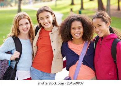 Group Of Young Girls Hanging Out In Park Together