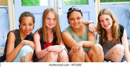 Group Of Young Girls Near School Building