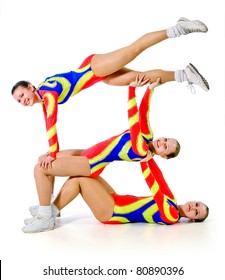 group of young gymnasts on a white background.sporting exercise.plastic study.aerobics.flexibility.sport.active rest.