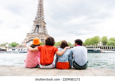 Group of young happy friends visiting Paris and Eiffel Tower, Trocadero area and Seine river - Multicultural group of tourists sightseeing the France capital city