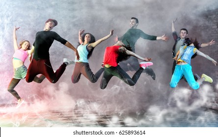 Group of young hip-hop dancers in studio - Powered by Shutterstock