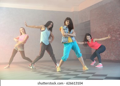 Group of young hip-hop dancers in studio - Shutterstock ID 626613104