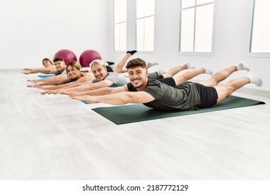 Group of young hispanic people smiling happy training at sport center. - Powered by Shutterstock