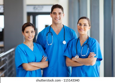 group of young hospital workers in scrubs - Powered by Shutterstock