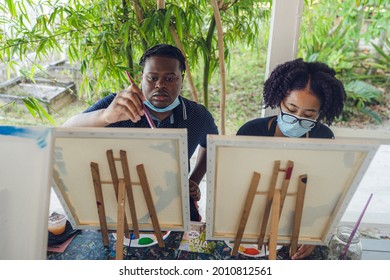 A Group Of Young Individuals Enjoying Paint N Sip Activities Outdoor. A Beginners Class For Painting. Nassau, Bahamas - May 29th, 2021