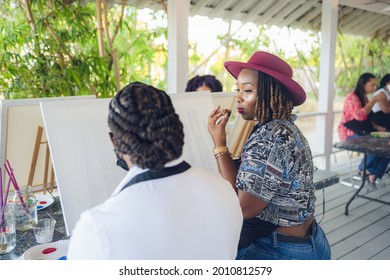 A Group Of Young Individuals Enjoying Paint N Sip Activities Outdoor. A Beginners Class For Painting. Nassau, Bahamas - May 29th, 2021