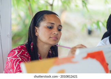 A Group Of Young Individuals Enjoying Paint N Sip Activities Outdoor. A Beginners Class For Painting. Nassau, Bahamas - May 29th, 2021