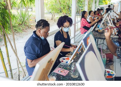 A Group Of Young Individuals Enjoying Paint N Sip Activities Outdoor. A Beginners Class For Painting. Nassau, Bahamas - May 29th, 2021