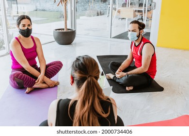 Group Of Young Latin People In Yoga Class Wearing Medical Mask In Latin America