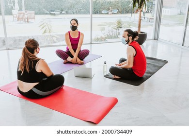 Group Of Young Latin People In Yoga Class Wearing Medical Mask In Latin America