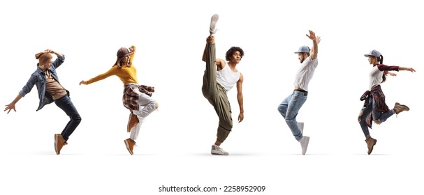 Group of young male and female dancers performing street dance isolated on white background