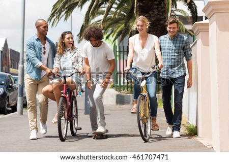 Similar – Image, Stock Photo A row of bicycles, behind them greenhouses, behind them the typical narrow buildings of downtown Amsterdam