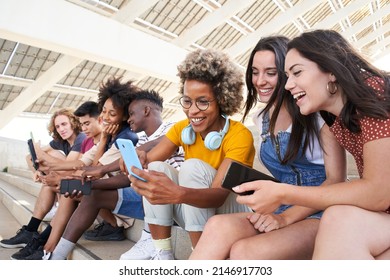 Group of young mixed race people with mobile phones. Excited students using their technological devices. Concept of young enterprising, friendly, selfie, app, hipster, millennial. - Shutterstock ID 2146917703
