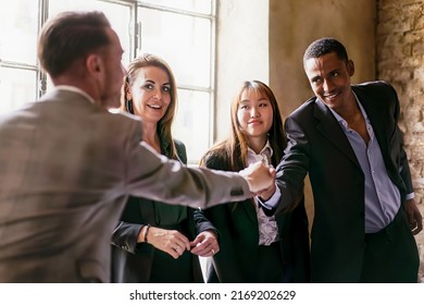 A Group Of Young Multi-ethnic Entrepreneurs Shaking Hands During A Working Business - Business Lifestyle Concept, International Trade Agreement