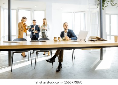 Group Of A Young Office Workers Eating Salads And Drinking Coffee At The Modern Office Canteen. Concept Of A Healthy Takeaway Food On The Work