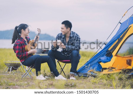 A group of young people camping in the jungle in the middle of nature