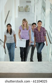 Group Of Young People Climbing Stairs