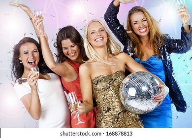 A Group Of Young People Dancing At Night Club. New Year Party 