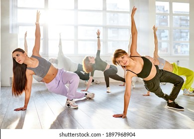 Group Of Young People Dancing Synchronized Choreography Together In Studio, Learn Dance Moves