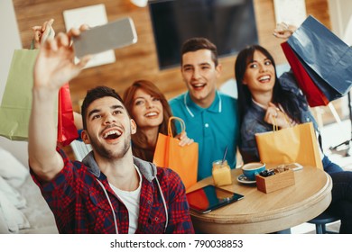 Group Of Young People Doing Selfie In A Cafe After Shopping