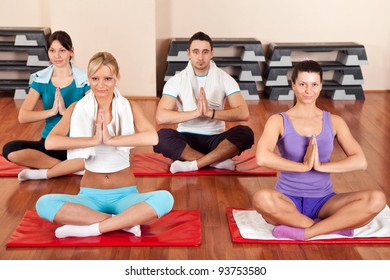 Group of young people doing yoga exercises