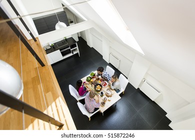 Group of young people eating in the modern interior view from above - Shutterstock ID 515872246
