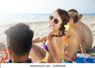 Group Of Young People Enjoying The Beach