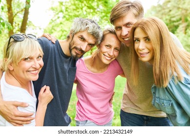 Group of young people as friends in a clique on a trip in nature in summer - Shutterstock ID 2213432149
