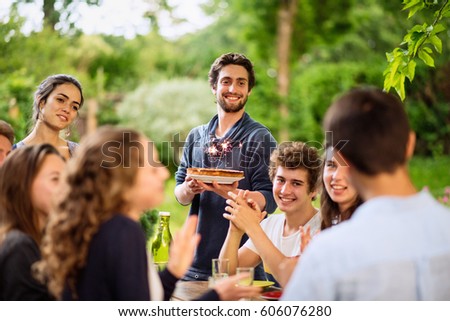 Similar – Man with piece of cake in a summer barbecue