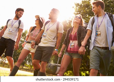 Group Of Young People Going Camping At Music Festival