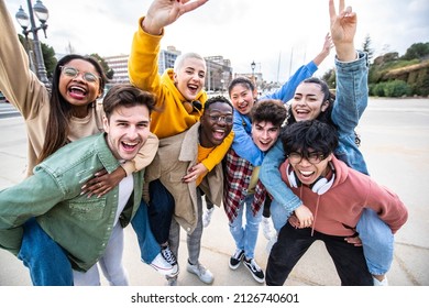 Group Of Young People With Hands Up Looking At Camera - Millenial Friends Having Fun Together On City Street - Multicultural Students Walking Outside University Campus - Youth Culture And Scholarship