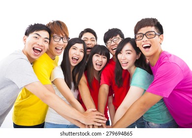 Group of young people with hands together - Shutterstock ID 279694865