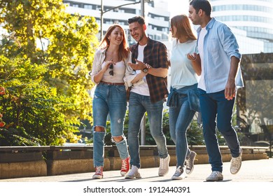 	
Group Of Young People Hangout At The City Street.They Walks Together And Making Fun.	
