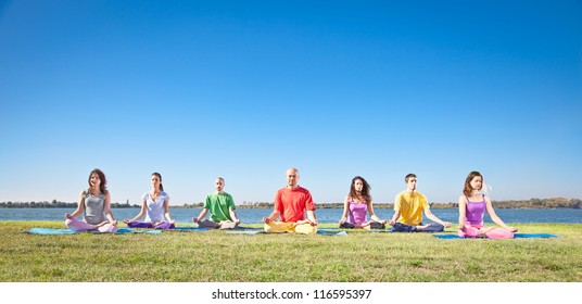 Group Of Young People Have Meditation On Yoga Class