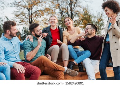 Group of young people having fun outdoors in a park
