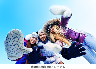 Group Of Young People Having A Rest Outdoor In Winter.