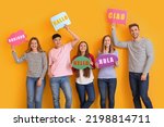 Group of young people holding speech bubbles with words HELLO in different languages on yellow background