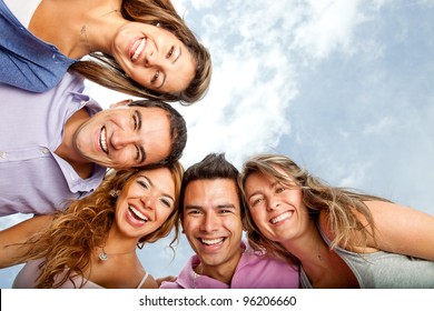 Group Of Young People Hugging And Laughing