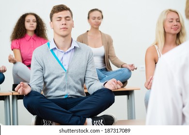 Group Young People Meditating Office Desk Stock Photo 187317089 ...