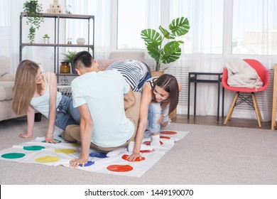 Group of young people playing indoors. Friends having fun. Active games. - Shutterstock ID 1449190070