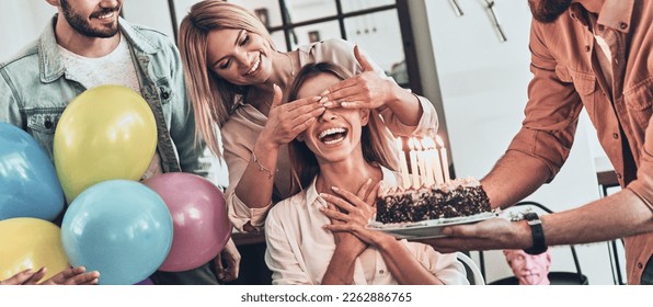 Group of young people preparing surprise party for their friend on birthday - Powered by Shutterstock