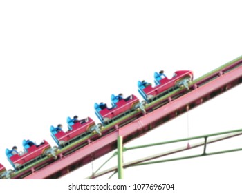 A Group Of Young People Riding Roller Coaster  Going Up To The Top. People Start To Get Scared