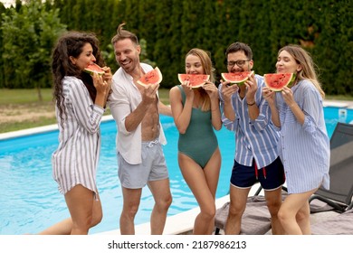 Group Of Young People Standing By The Swimming Pool And Eating Watermelon In The House Backyard