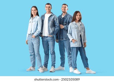 Group of young people in stylish denim clothes on blue background - Powered by Shutterstock