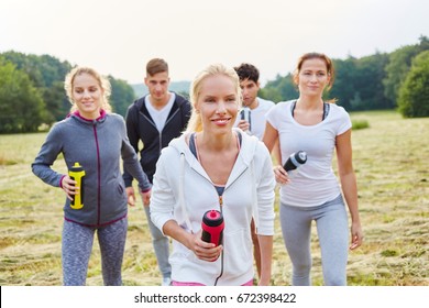 Group of young people taking a break from fitness class
