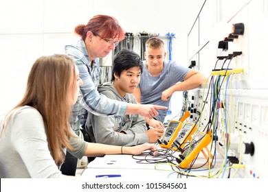 Group of young people in technical vocational training with teacher 