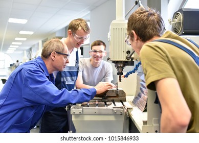 Group of young people in technical vocational training with teacher 